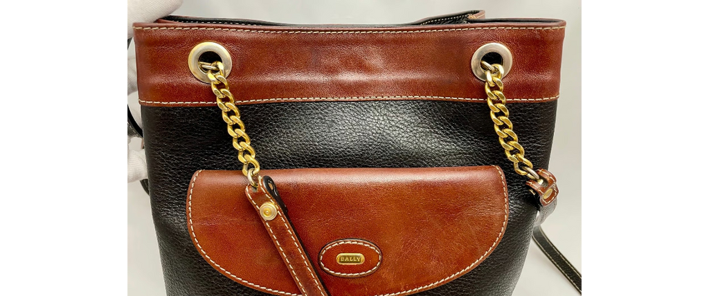 Vtg Bally Double Strap Leather Bucket Shoulder Bag in Black/Tan, made in Italy